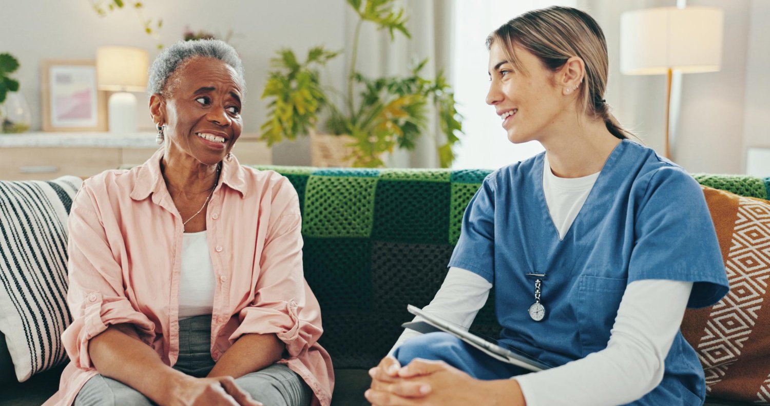 Family member talking with an older relative at home